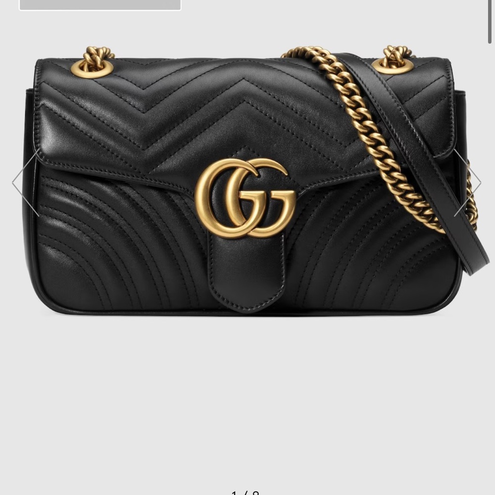 Black Gucci cross body bag with gold chain